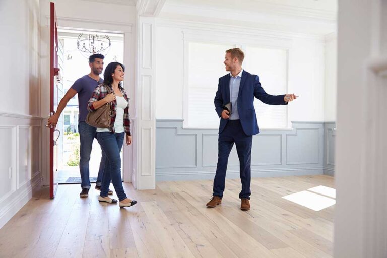 Homeowner reviews a clean living room checklist beside a bright window before listing the property.